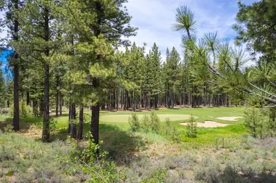 a view of a golf course with trees and a green at Annie's Loop, Gray's Crossing 10215 in Truckee