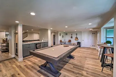 a living room with a pool table in it at Hot Tub, Pool Table Luxe Reno Chalet with Mtn View! in Reno