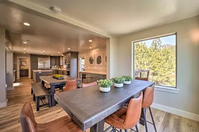 a kitchen and dining room with a table and chairs at Hot Tub, Pool Table Luxe Reno Chalet with Mtn View! in Reno
