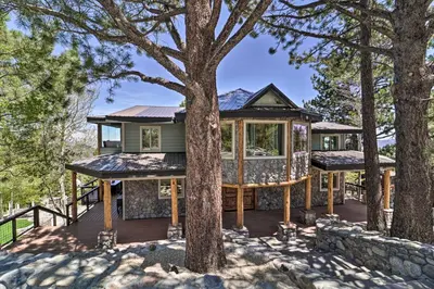 a tree house with a wrap around deck at Hot Tub, Pool Table Luxe Reno Chalet with Mtn View! in Reno