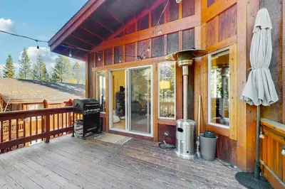 a porch of a wooden house with a grill at Truckee Treat in Truckee