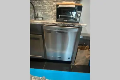 a kitchen with a stove and a microwave at Comfy, Quiet, Condo near Lake Mary and the Village in Mammoth Lakes