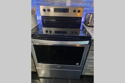 a stove top oven in a kitchen at Comfy, Quiet, Condo near Lake Mary and the Village in Mammoth Lakes