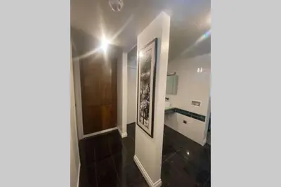a room with a bathroom with a sink and a mirror at Comfy, Quiet, Condo near Lake Mary and the Village in Mammoth Lakes