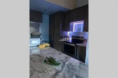 a kitchen with a marble counter top in a room at Comfy, Quiet, Condo near Lake Mary and the Village in Mammoth Lakes