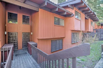 an orange building with a wooden fence in front of it at Contemporary Mountain Retreat - Walk to Slopes! in Mammoth Lakes
