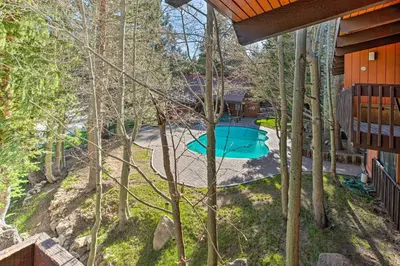 an aerial view of a backyard with a swimming pool at Contemporary Mountain Retreat - Walk to Slopes! in Mammoth Lakes