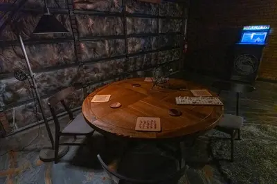 a wooden table in a room with chairs and a table at Cozy mountain retreat with lake views near Yosemite in Groveland