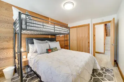 a bedroom with a bed and a bunk bed at 1 Mi to Northstar Skiing Cozy Pet-Friendly Condo! in Truckee