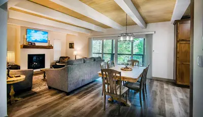 a living room with a table and a couch at 12R Hilltop Haven in North Wawona