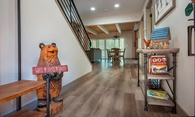 a hallway with a bear statue in a house at 12R Hilltop Haven in North Wawona