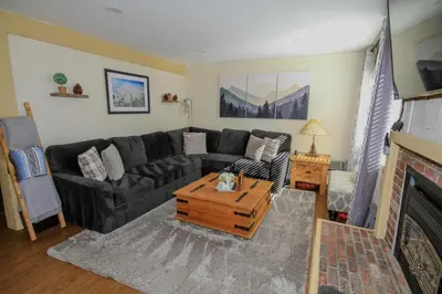 a living room with a couch and a coffee table at Mammoth Ski Racquet Club 105 - Pet Friendly in Mammoth Lakes