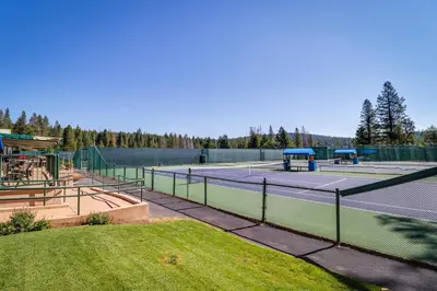 a tennis court with two tennis courts at Hammock Holidays in Truckee