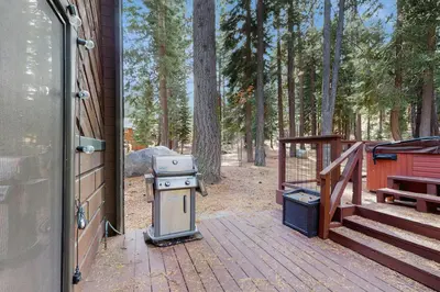 a stove sitting on a deck next to a house at Hammock Holidays in Truckee