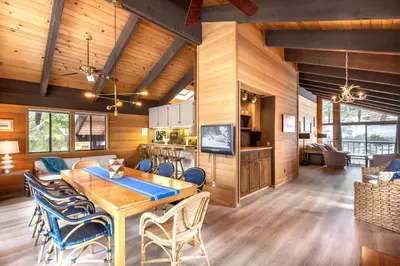 a dining room and kitchen with a table and chairs at Beautiful 4-Bedroom Contemporary Mountain Home condo in Truckee