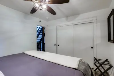 a bedroom with a bed and a ceiling fan at Cold Springs Escape AandC, Hot Tub, Generator, WiFi in Cold Springs