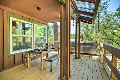 a screened porch with a table and chairs on a deck at Cabin Less Than Half-Mi from Pine Mountain Lake Marina! in Groveland