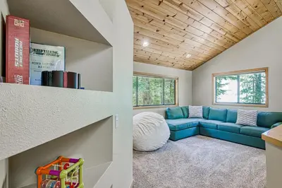 a living room with a blue couch in a house at Blue Antler in Truckee