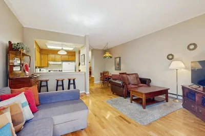 a living room with a couch and a kitchen at Tahome & Tahoe Place in Incline Village