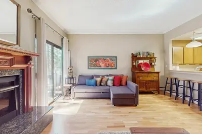 a living room with a couch and a fireplace at Tahome & Tahoe Place in Incline Village