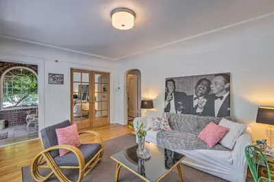 a living room with a couch and a table at Historic Reno Home on Riverwalk 1 Mi to Midtown in Reno