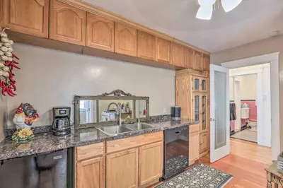 a kitchen with a sink and a counter top at Historic Reno Home on Riverwalk 1 Mi to Midtown in Reno