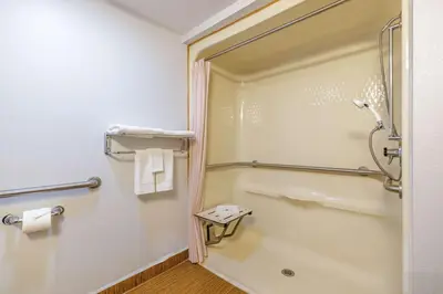 a bathroom with a shower and a toilet at Motel 6-Auburn, CA in Auburn