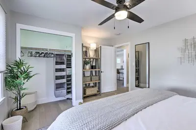 a bedroom with a bed and a ceiling fan at Hot Tub, Fire Pit Midtown Reno Oasis! in Reno