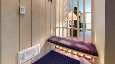 a purple bench in a room with a window at Crestview #25 condo in Mammoth Lakes