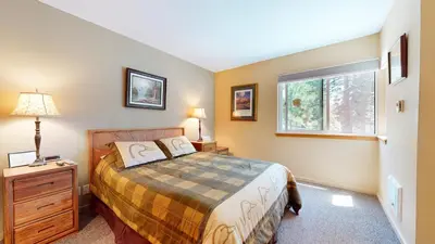 a bedroom with a bed and a window at Crestview #25 condo in Mammoth Lakes