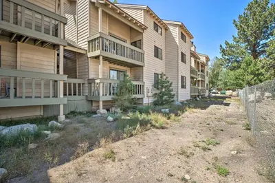 a building with a fence in front of it at Cozy Family Condo in Mammoth Lakes with Balcony in Mammoth Lakes