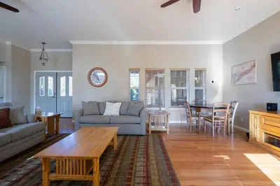 a living room with a couch and a table at Fraser Family Vineyard Estate Pet-Friendly Home in Plymouth