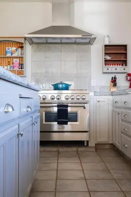 a kitchen with a stove top oven in a kitchen at Fraser Family Vineyard Estate Pet-Friendly Home in Plymouth