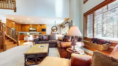 a living room with a couch and a table at Timbers #10 townhouse in Mammoth Lakes