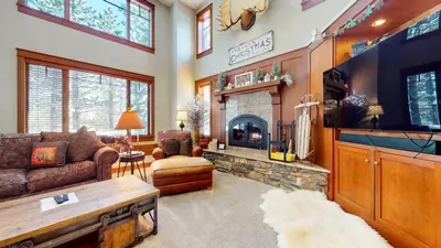 a living room with a couch and a fireplace at Timbers #10 townhouse in Mammoth Lakes