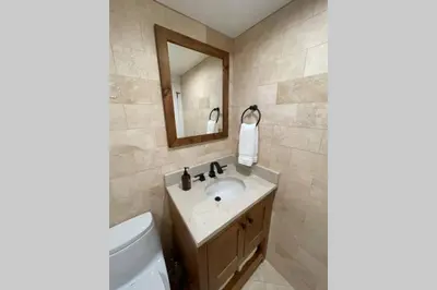 a bathroom with a sink and a mirror at DNA Chalet - Newly Renovated Townhome @ Northstar in Truckee