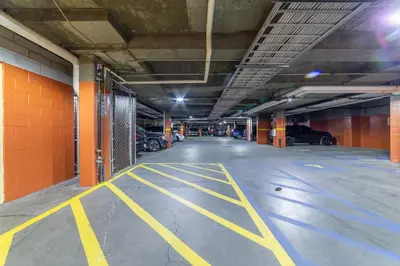 an empty parking garage with cars parked in it at Luxury Oasis Village Ski-in Ski-out in Mammoth Lakes