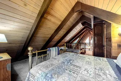 a bedroom with a bed in a attic at Sierra Dream in South Lake Tahoe