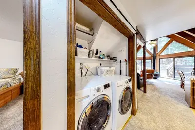 a laundry room with a washer and dryer at Sierra Dream in South Lake Tahoe