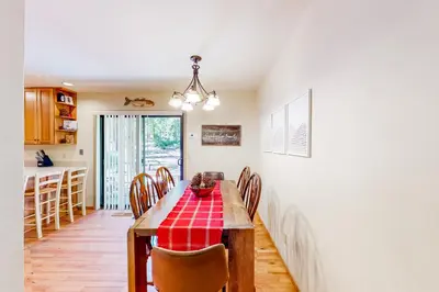 a kitchen and dining room with a table and chairs at Relax on Pretoria in Carnelian Bay