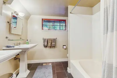 a bathroom with a sink and a tub and a shower at Serene Lakes Splendor in Soda Springs