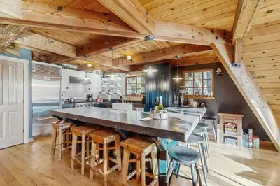 a large kitchen with a large table and chairs at Serene Lakes Splendor in Soda Springs