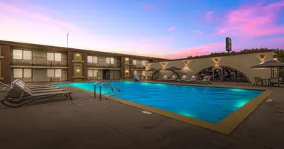 a large swimming pool in a building with a hotel at Best Western Roseville Inn in Roseville