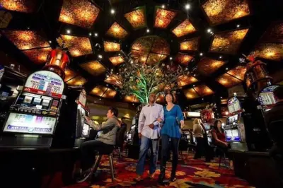 a group of people standing in a casino at High Sierra Retreat with a view of Pinecrest lake in Pinecrest