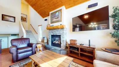 a living room with a couch and a fireplace at Mammoth Gateway Village #7 condo in Mammoth Lakes