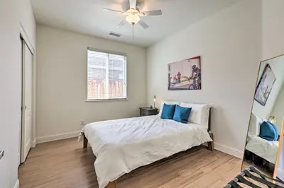 a bedroom with a bed and a ceiling fan at 12 Mi to Riverwalk District Quiet Reno Retreat in Reno