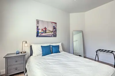 a bedroom with a bed and a painting on the wall at 12 Mi to Riverwalk District Quiet Reno Retreat in Reno