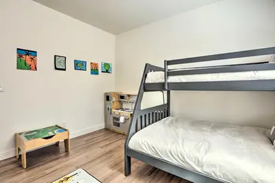 a bedroom with two bunk beds and a table at 12 Mi to Riverwalk District Quiet Reno Retreat in Reno