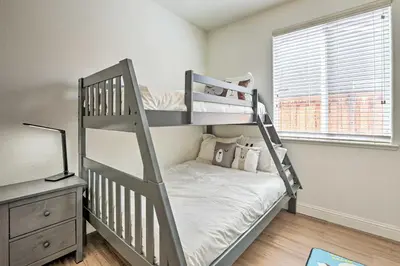 a bedroom with two bunk beds and a mirror at 12 Mi to Riverwalk District Quiet Reno Retreat in Reno