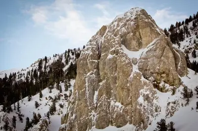 a large rocky mountain with snow on it at Juniper Springs 444 in Mammoth Lakes